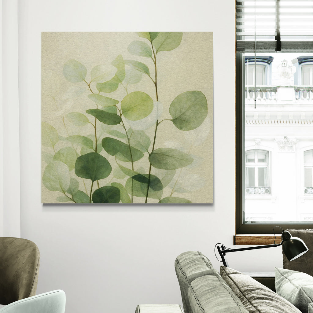 Framed artwork of green leaves on a wall in a living room.