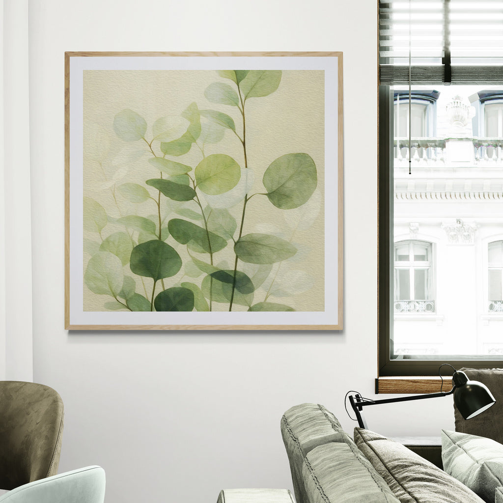 Framed artwork of green leaves on a wall in a living room.