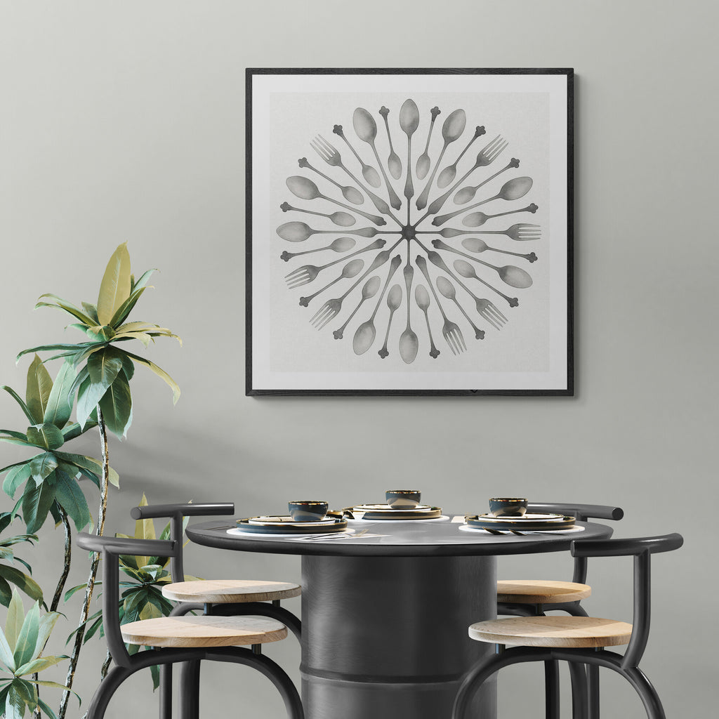 Dining area with a round table and stools, framed artwork on the wall, and a plant.