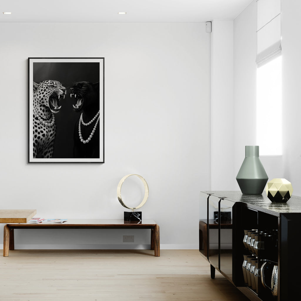 Modern interior with a framed artwork of two leopards on a white wall.