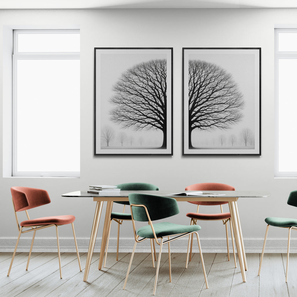 Dining area with a glass table and colorful chairs against a white wall with tree-themed artwork.