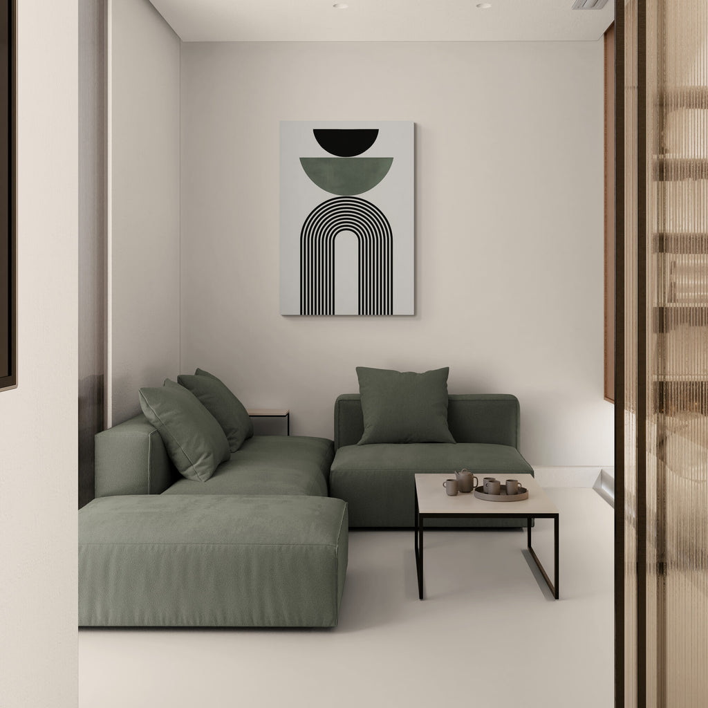 Modern living room with a green sofa and abstract wall art.